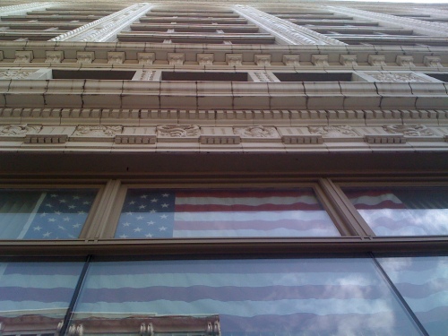 Flag window shot outside my office building, downtown Saint Louis. Photo By Michael L. Shaw.